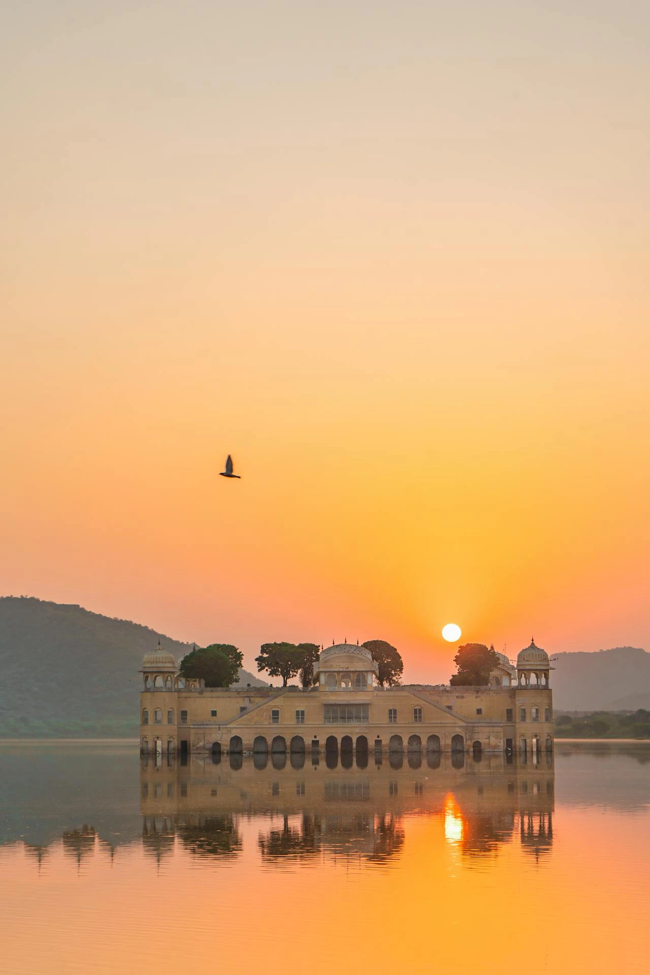 Sunburst over Indian structure on water